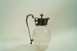 A late 19th century cut glass and plated claret jug,
