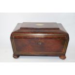 A mid 19th century rosewood needlework box with two handles on bun feet,