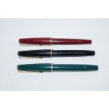 A Parker 17 Lade (1964) (3 off) green, maroon & black, covered points,