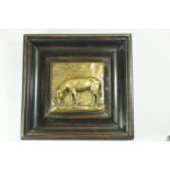 A 20th century square bronze plaque of a donkey grazing, within an ebonised frame,