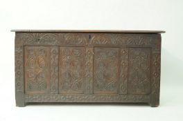 A 17th century and later oak coffer with quadruple panelled front, 69.