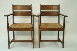 A set of four oak Arts and Crafts style chairs, each with double oak plank back,