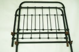 An early 20th century single iron bed frames,