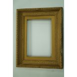 A Victorian plaster on wood moulded frame, later gold painted,
