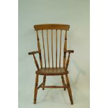 A beech stick back elbow chair with solid seat and turned legs