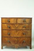 A 19th century mahogany bow fronted chest of two short and three long drawers, 104cm high, 101.