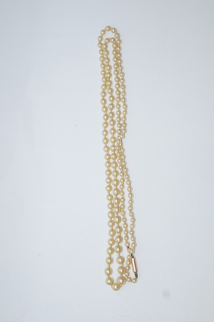 A graduated string of simulated pearls