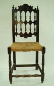 A 17th century style chair, with bobbin turned back,