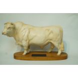 A Beswick connoisseur model Charolaise bull with matt glaze on wooden plinth with title plaque,