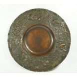 A late Victorian Elkington & Co copper wall plate, with embossed art nouveau style flowers,
