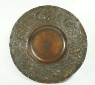 A late Victorian Elkington & Co copper wall plate, with embossed art nouveau style flowers,