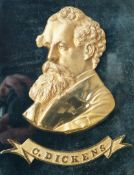 A Victorian gilt metal relief portrait bust of Charles Dickens, with name plate,