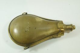 A late 18th century horn and brass mounted powder flask with two ring handles, 7.