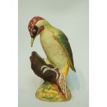 A Beswick model of a green woodpecker with matt glaze, second version 1218B, moulded marks,