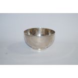 A silver bowl, maker J.H.O., London 1969, of plain form on a rim foot, 5.3 cm high, 9.8 cm across.