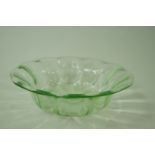 A Loetz type glass bowl with a green tint,