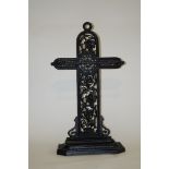 A Victorian style cast iron umbrella stand, painted black,