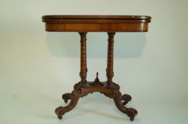 An Edwardian mahogany card table, with four turned supports on waisted rectangular plinth,