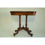 An Edwardian mahogany card table, with four turned supports on waisted rectangular plinth,