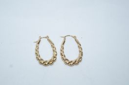A pair of earrings, stamped '375', of long graduated barley twist hoop design, 1.