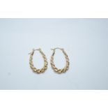 A pair of earrings, stamped '375', of long graduated barley twist hoop design, 1.