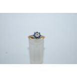 A sapphire and diamond cluster ring