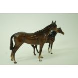 A Beswick bay horse, 20cm high, along with another similar, 15cm high,