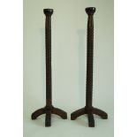 A pair of Arts and Crafts style candlestands,