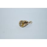 A 9ct gold seal charm, set with an oval cut citrine, 2.8 g gross, 8.