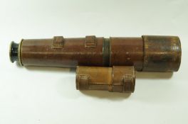 A brass three drawer telescope, with leather casing, 73.