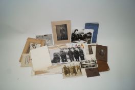 A collection of military photos, booklets, greetings cards,