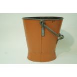A large metal coal bucket with swing handle,