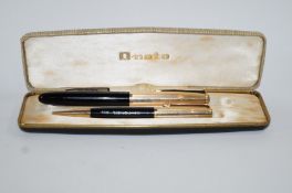 A DLR Onoto 1955/58 K series fountain pen & pencil with yellow metal caps,