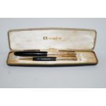 A DLR Onoto 1955/58 K series fountain pen & pencil with yellow metal caps,