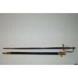 A 1796 pattern military sword the blade engraved within a leather and brass mounted scabbard,