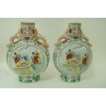 A pair of oriental moon vases, printed with figures and painted with enamels,