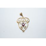 An Edwardian garnet topped doublet and seed pearl pendant, tagged '9ct', 3.5 cm long, 2.