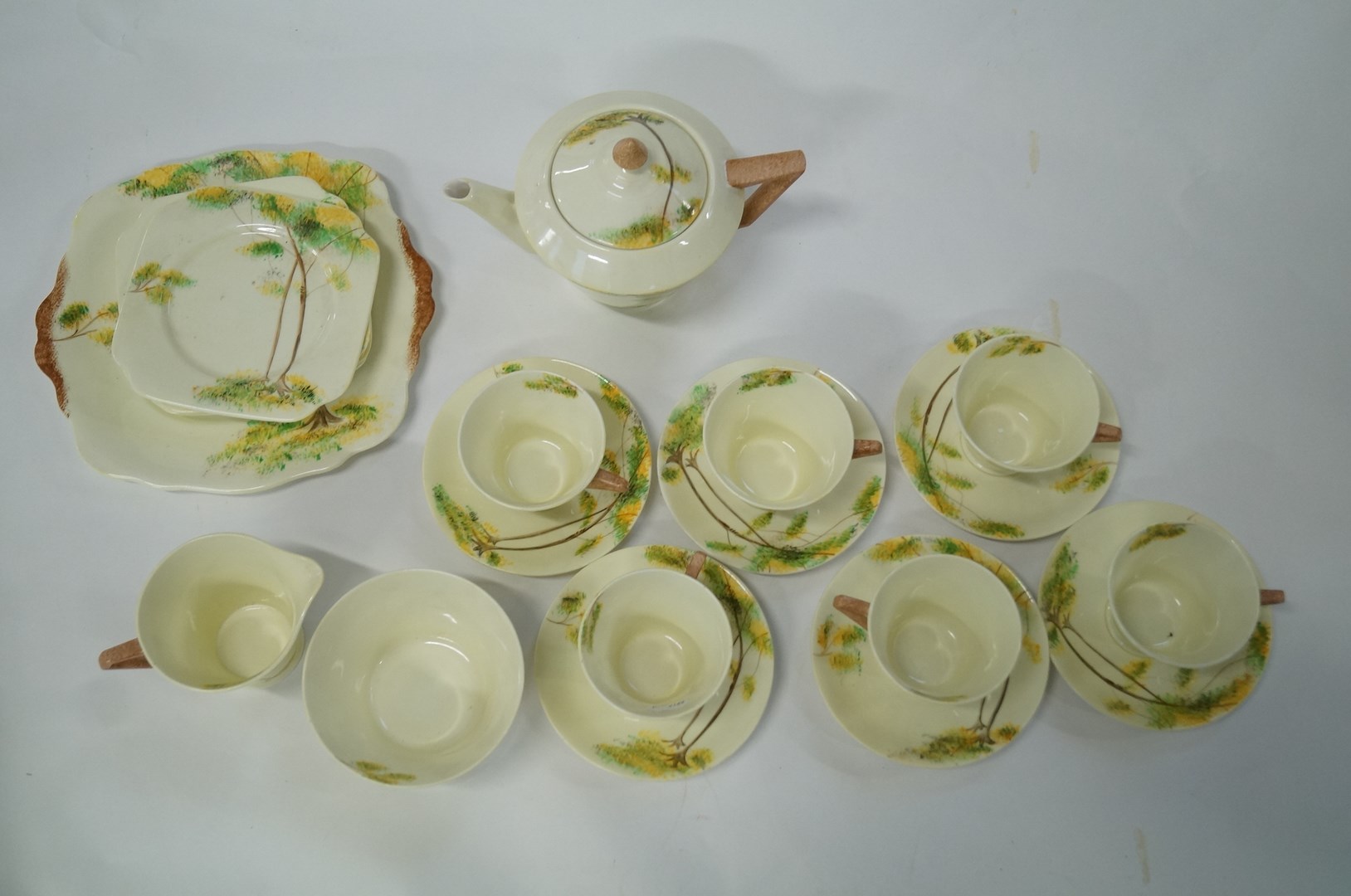 A Bell China tea service painted with trees in a landscape, to include six tea cups, six saucers,