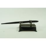 A pen metal desk stand, circa 1930, together with a  Waterman Skywriter lever fill fountain pen,