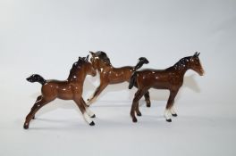 Three Beswick bay foals, each with black printed marks, Beswick,