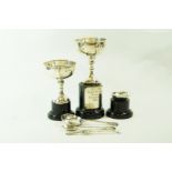 A matched pair of small silver trophy cups; and three silver golfing spoons; 197 g (6.