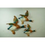 A set of three Beswick graduated  flying ducks, moulded marks 596-2, 596-3, 596-4,