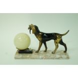 A French Art Deco spelter figure of a dog and spherical light, 19cm high,