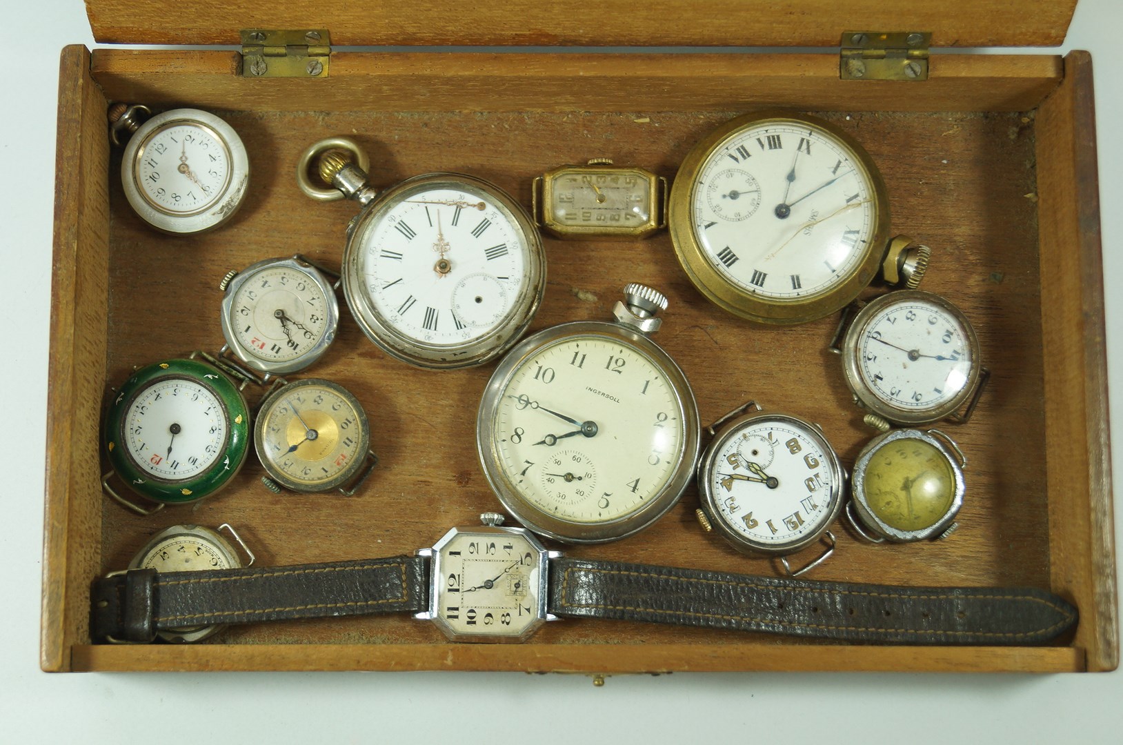 A continental silver coloured pocket watch; two metal pocket watches; an enamelled fob watch;