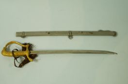 An early 20th century paper knife in the form of a sword and scabbard,
