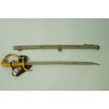 An early 20th century paper knife in the form of a sword and scabbard,