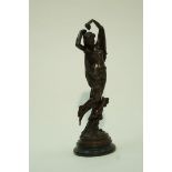 A bronze of a lady and a putti on black marble plinth,