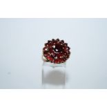 A twenty five stone garnet 9 carat gold cluster ring, finger size M1/2, 5.