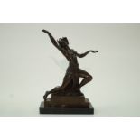 A bronze figure of a dancing lady on rectangular black marble plinth, 39.