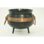 A cast iron cauldron with lion mask and ring handles, 30cm high,